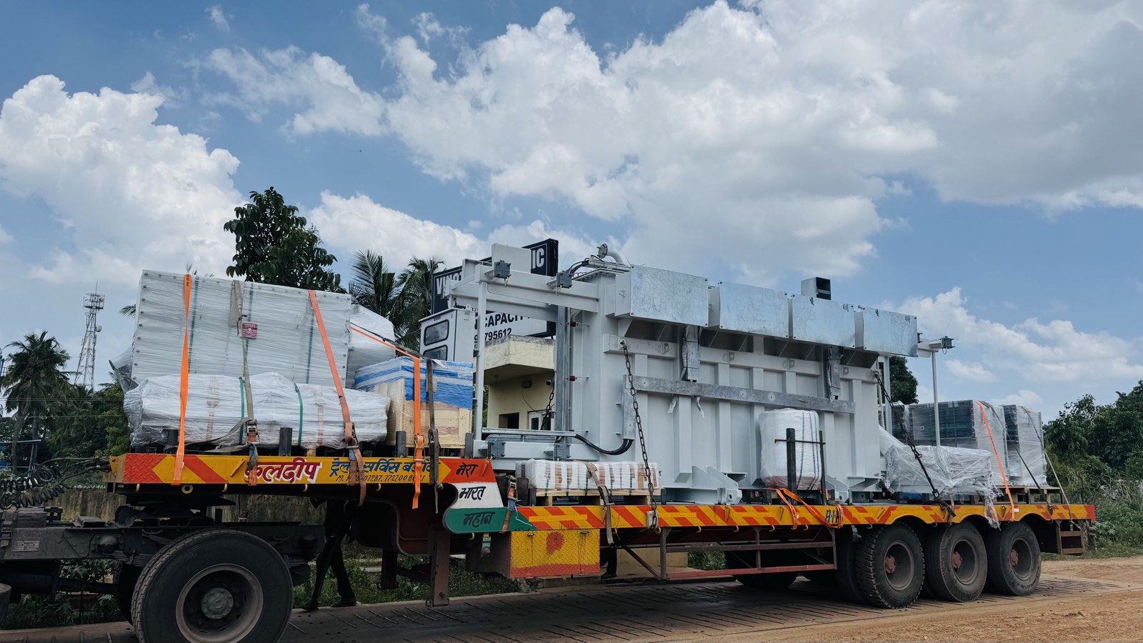 Transformer consignment lashed to a three-axle flatbed